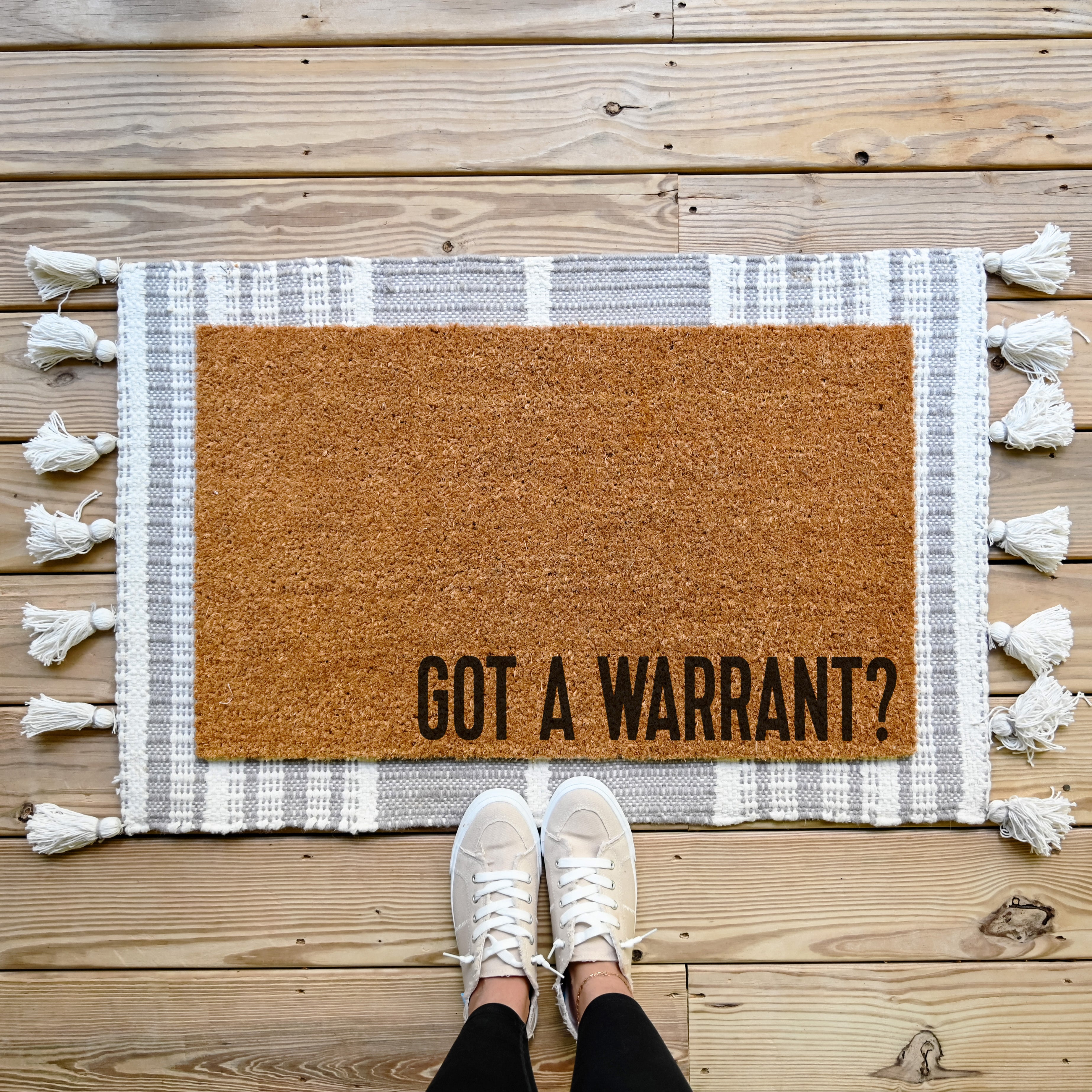 funny doormat that says got a warrant