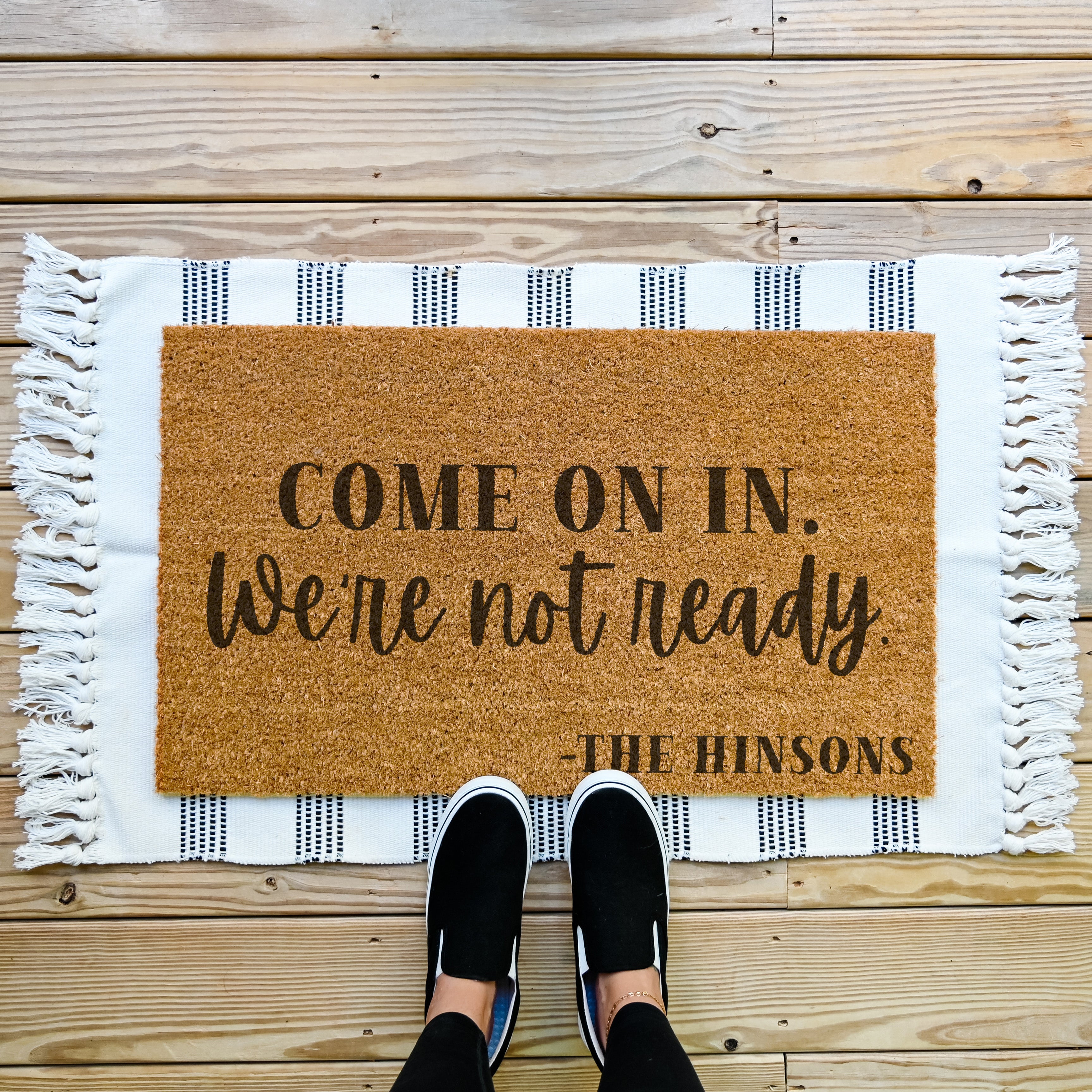 funny personalized doormat that says come on in, we're not ready