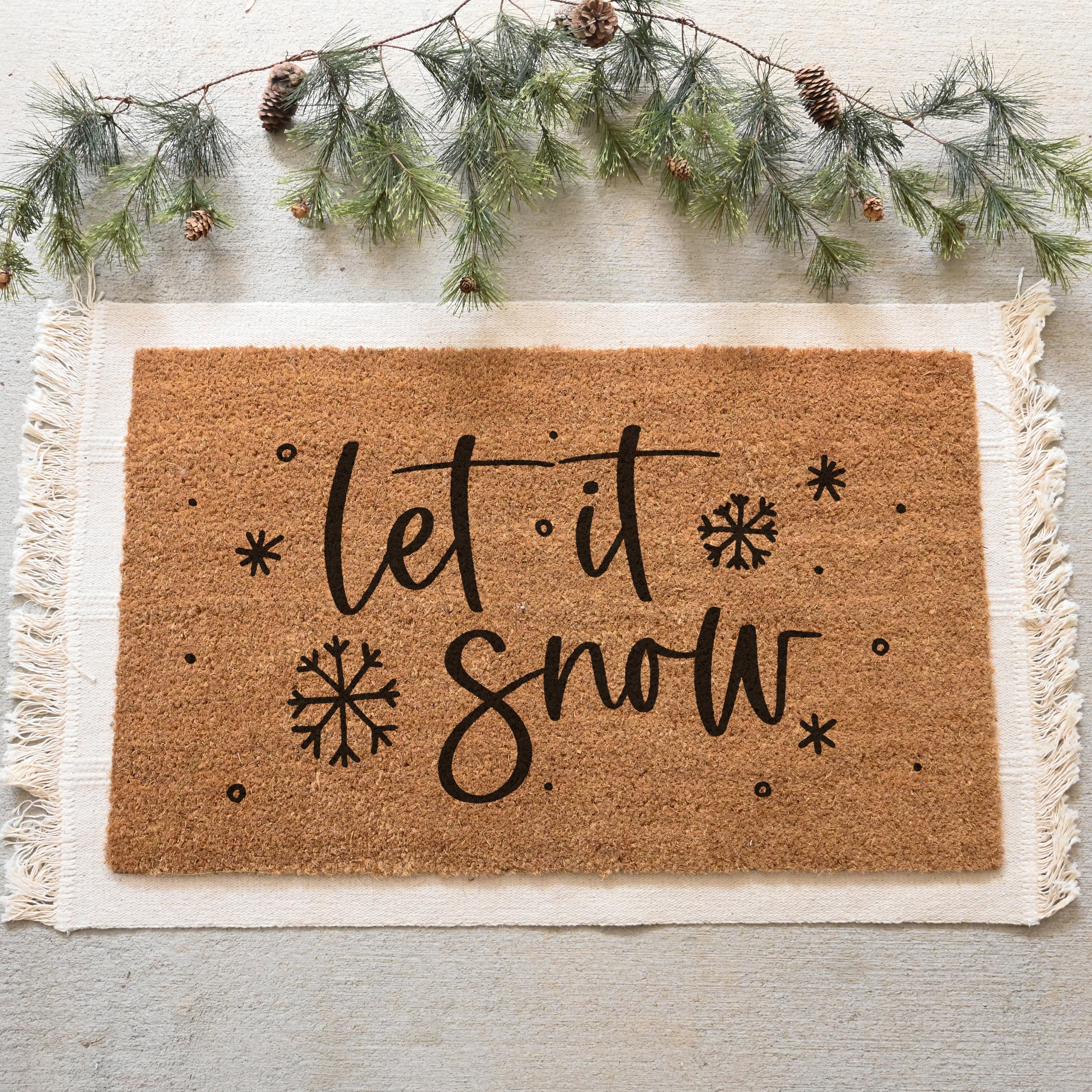 Let it Snow Doormat. Coir doormat. Snowflakes falling all over the mat.