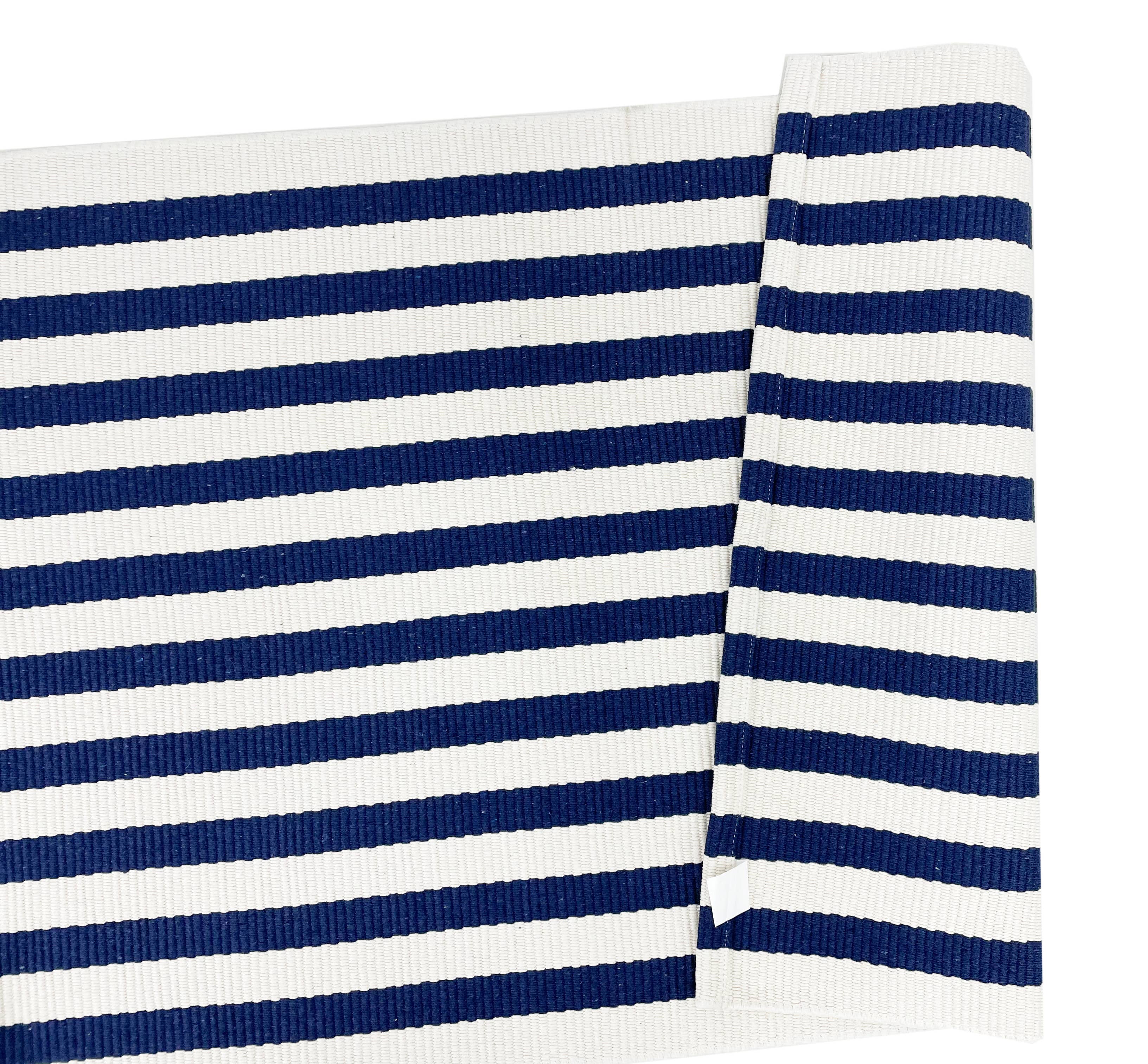 Navy and white striped fabric on a white background