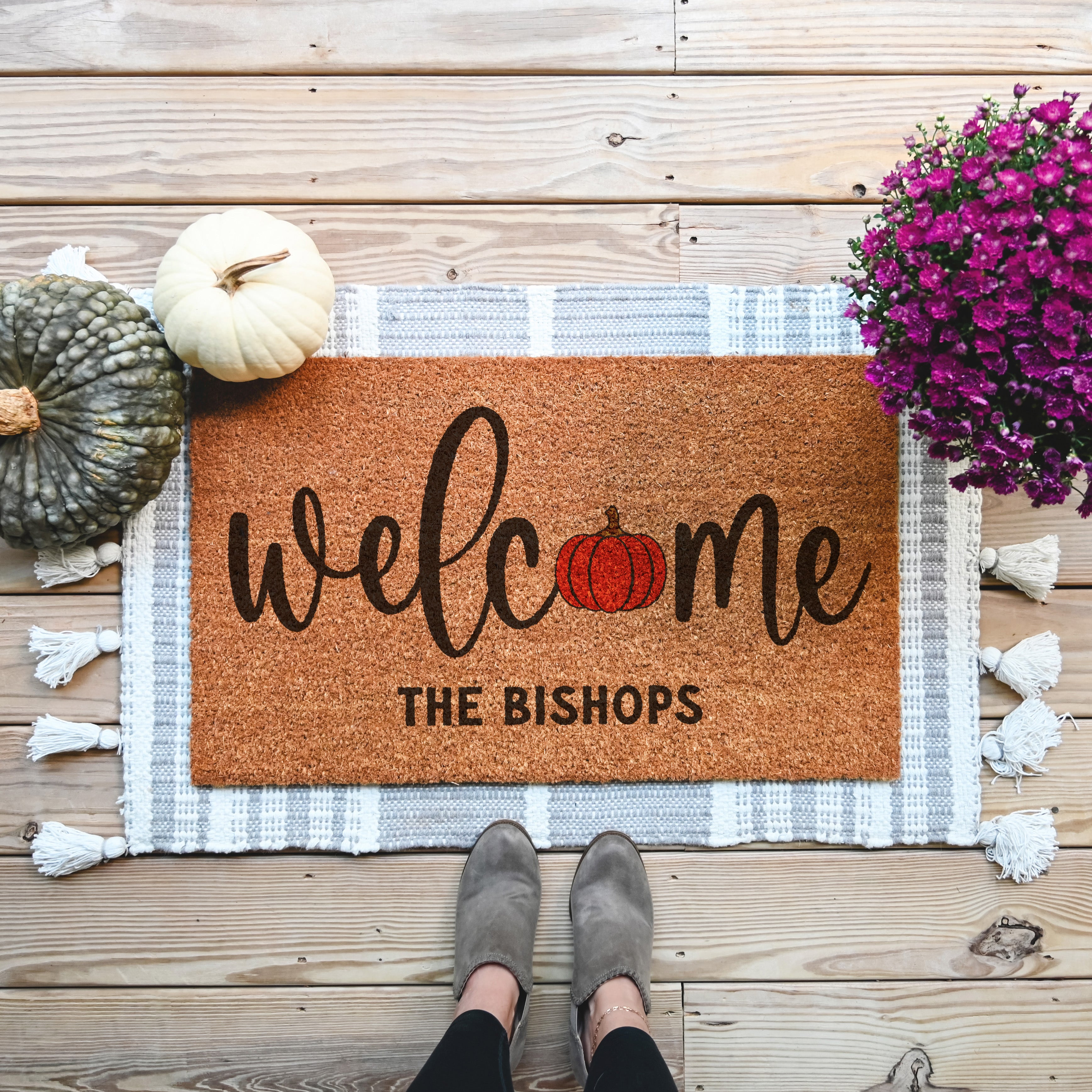 Personalized welcome doormat that has a pumpkin in place of the O. You can personalized a 2nd line to say your last name.