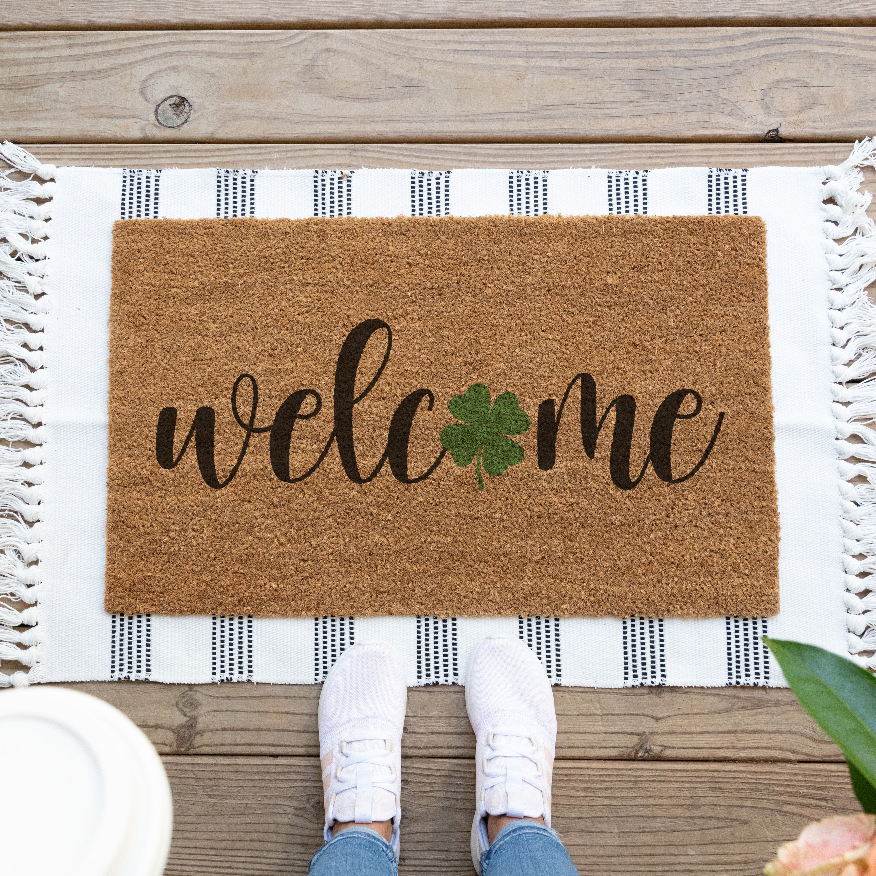 St Patricks Day welcome mat with green shamrock in place of the O in welcome