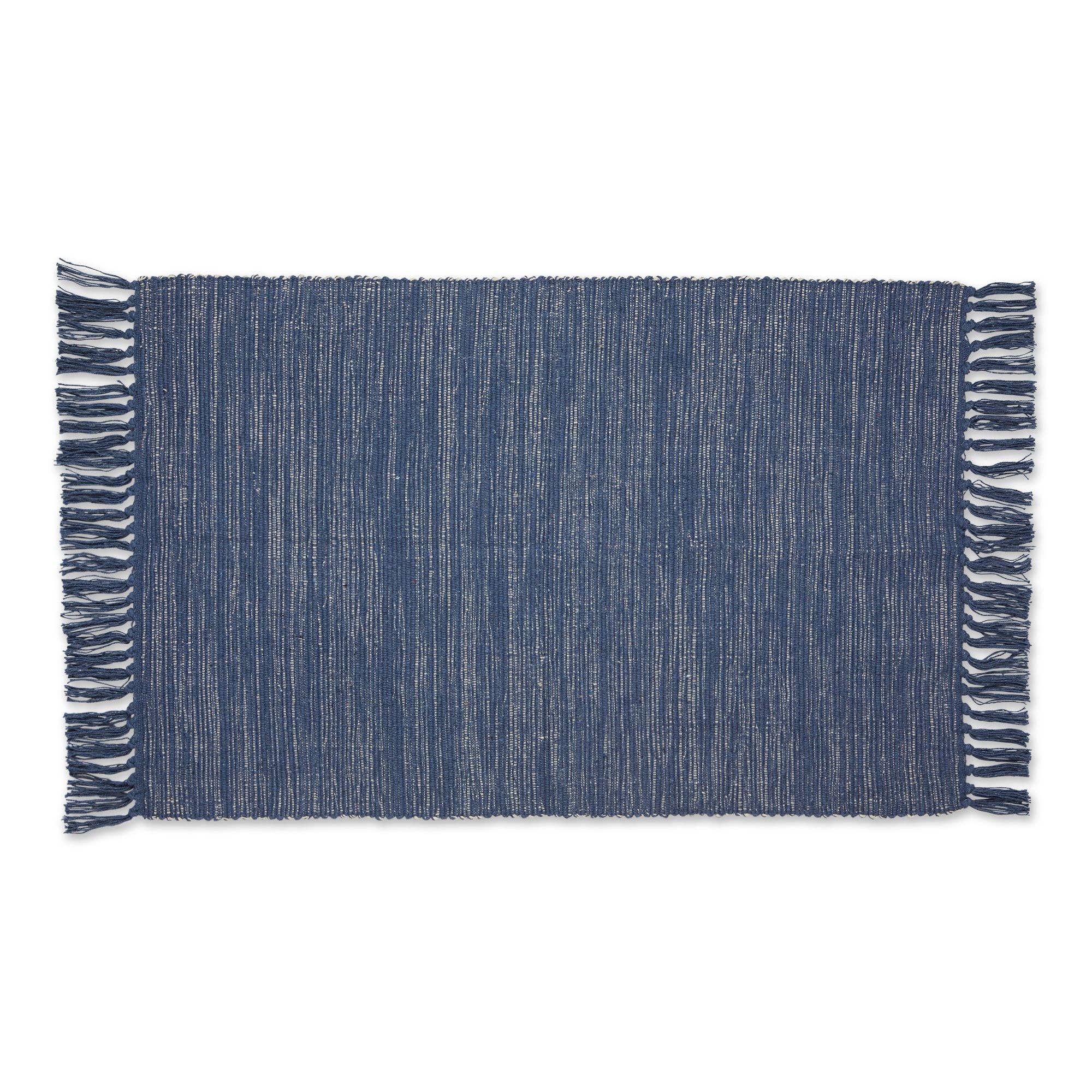 Blue woven mat with fringe on a white background